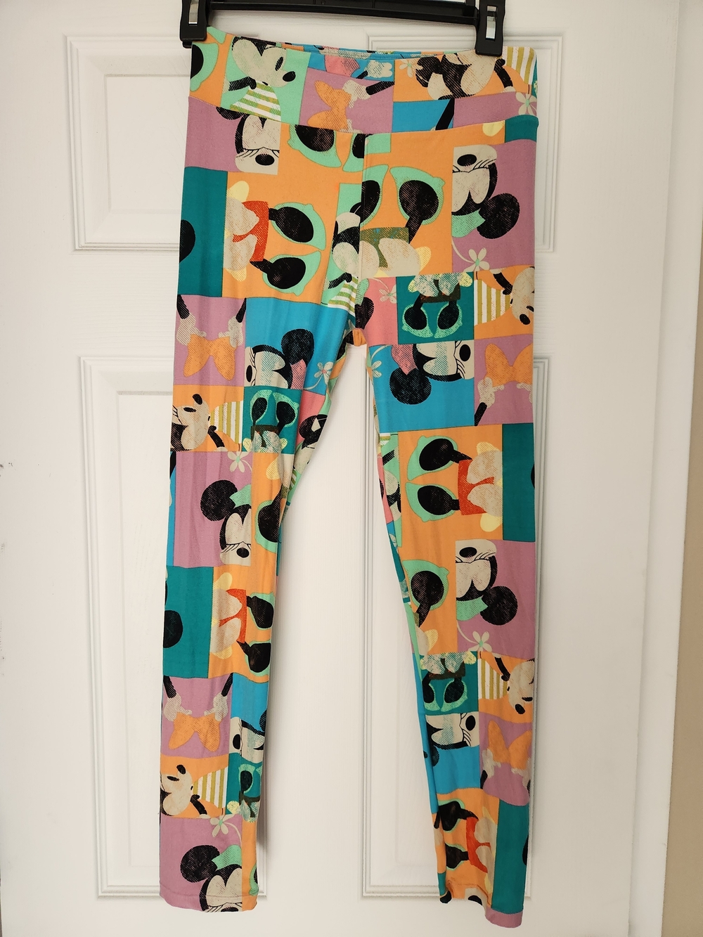 LuLaRoe Colorblock Cartoon Print Leggings in Teal, Peach, Lavender and Black